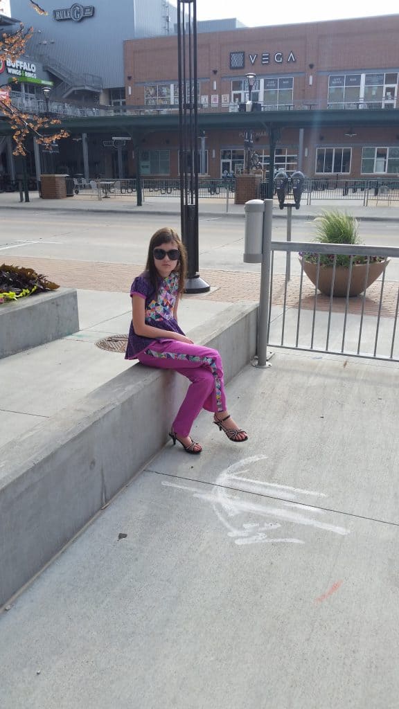 Girl sitting on ledge