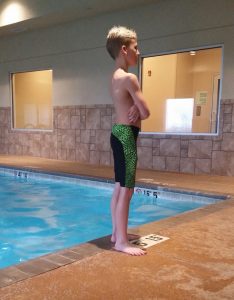 boy wearing swim jammers